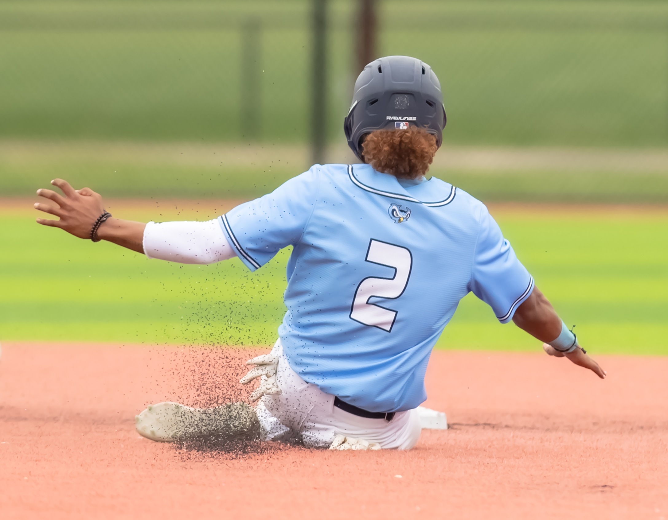 Second baseman Aderlyn Cubilete (2) slides into second base during game two of the Owls doubleheader against Frederick Community College on Saturday, April 24th.